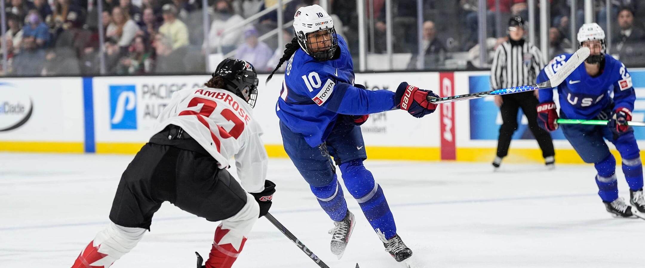 Laila Edwards, number 10, playing hockey.