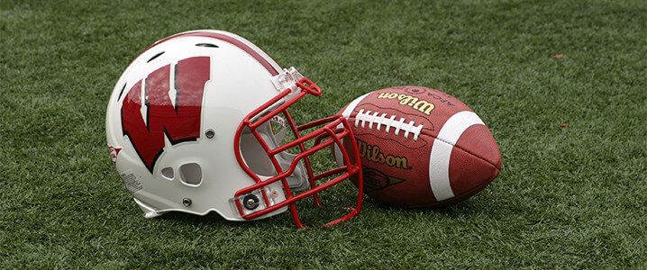 Badger football helmet and football.