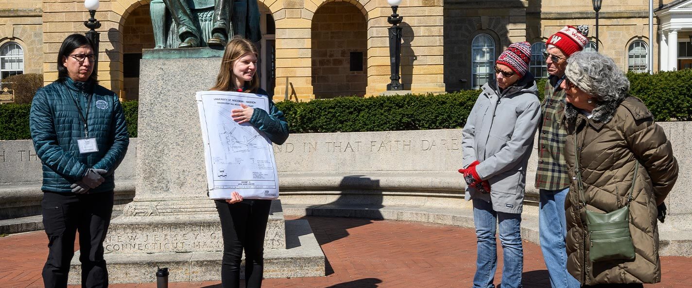 Guides Kane Funmaker ’24 and Abbey Woldt x’26 present information to tour group. 